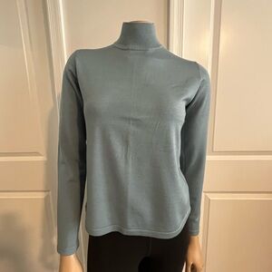 Pretty blue mock neck sweater, never worn, no tags and unsure of brand